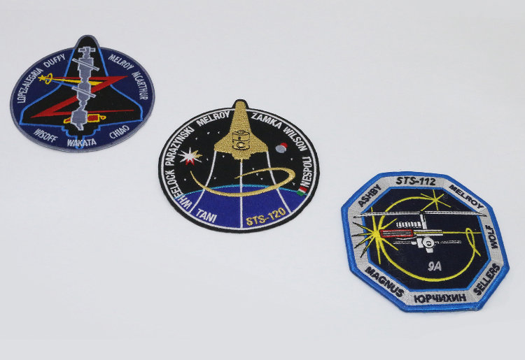 Three of Pam's astronaut badges